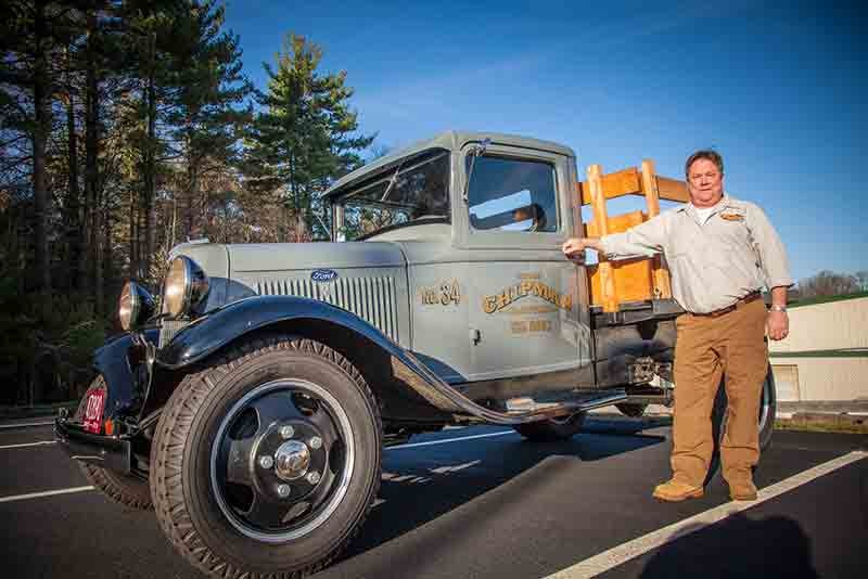 Thomas Chipman with the company's vintage 1934 Ford truck